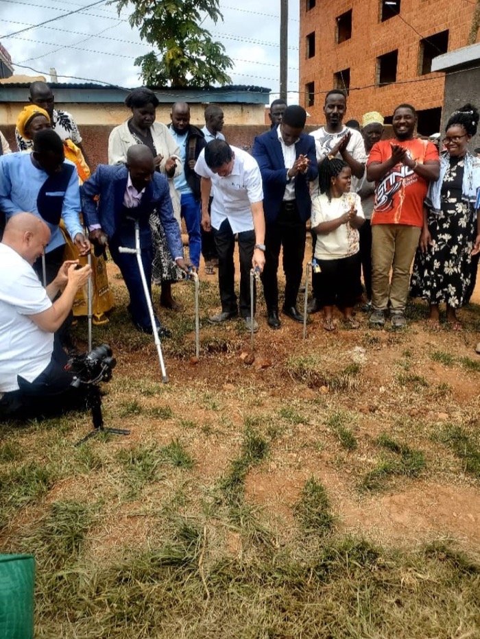 Community members and guests commission new water taps at a KPDDI ceremony in Kireka