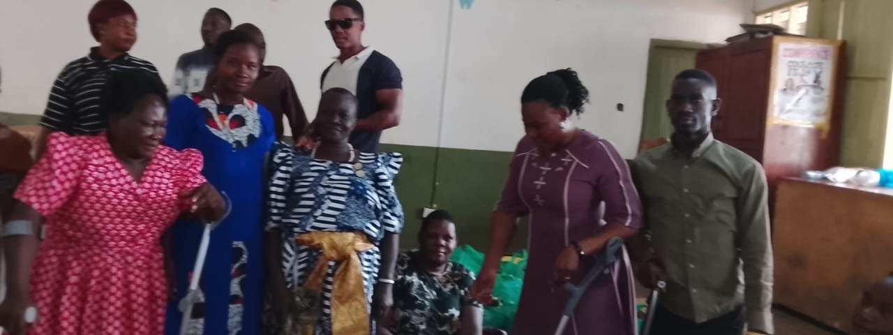 KPDDI members and support packages at a distribution in the community hall